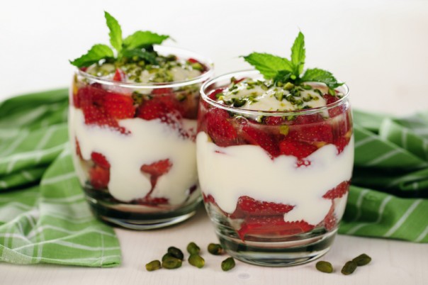 Greek yogurt with strawberries, honey and pistachios; selected focus